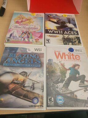 Lot of 9 Nintendo Wii Video Games Shaun White Skateboarding Blazing Angels WWII
